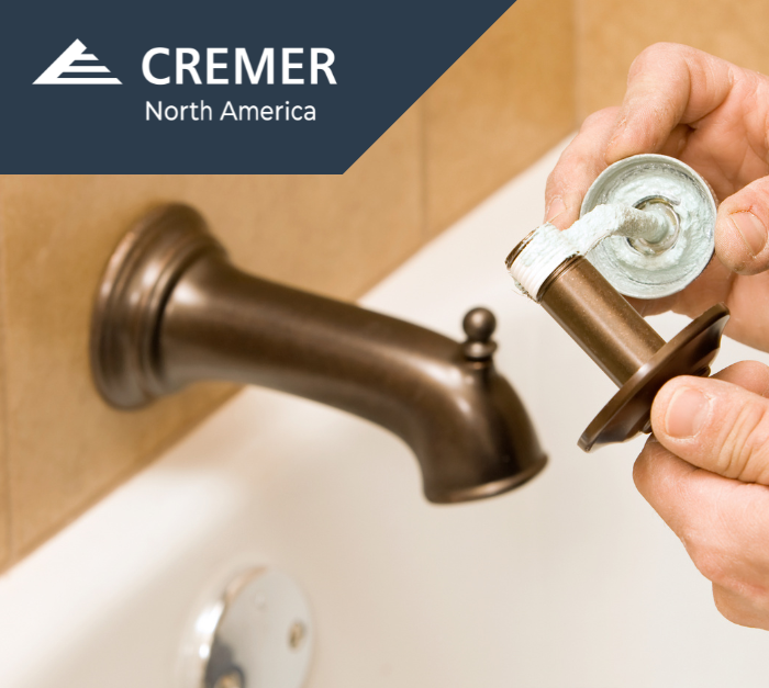 Applying adhesive sealant in plumbing fixture installation demonstrating physical form in adhesives